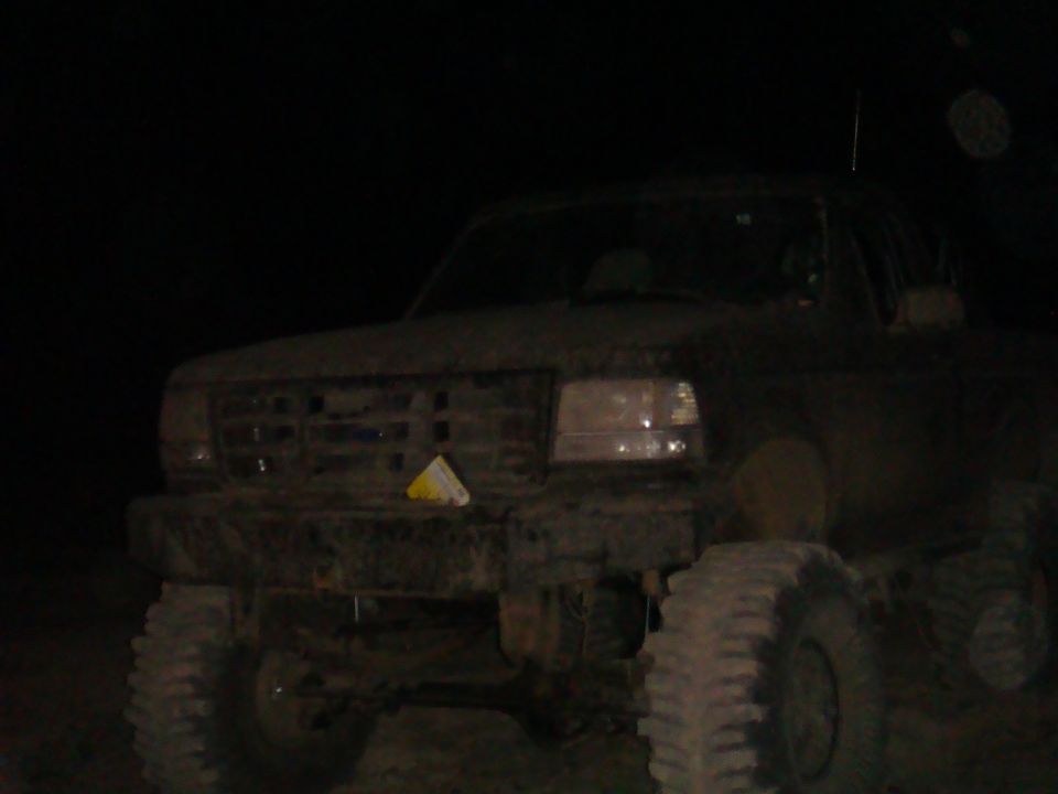 1992 Ford Bronco front view, covered in mud