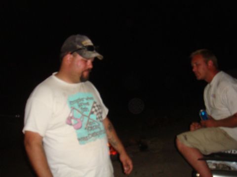 1992 Ford Bronco - Two men are seen outdoors at night, with one in the foreground and another in the background.