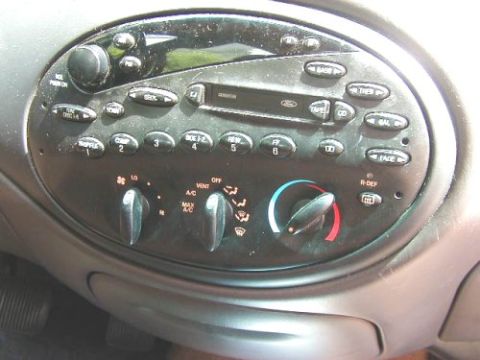 1997 Ford Taurus - The interior of a 1997 Ford Taurus shows the climate controls and radio unit.