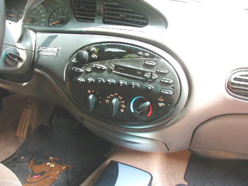 1997 Ford Taurus interior dashboard with radio and climate controls visible