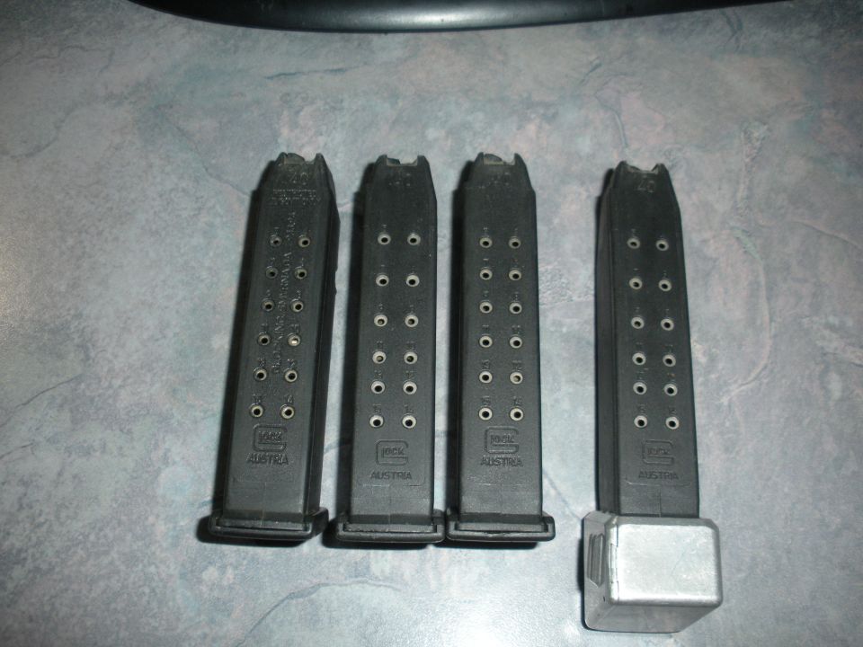 Four Glock magazines with "GLOCK AUSTRIA" visible on each