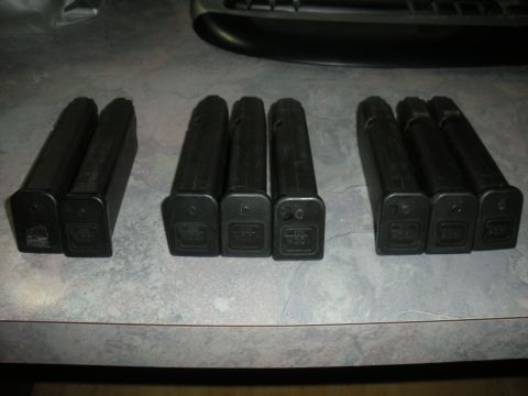 1996 Ford Bronco - Eight Glock magazines are laid out on a counter surface.