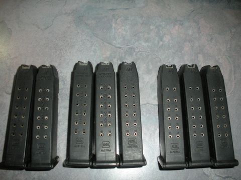 1996 Ford Bronco - Multiple Glock magazines are visible, some marked with caliber and capacity information.