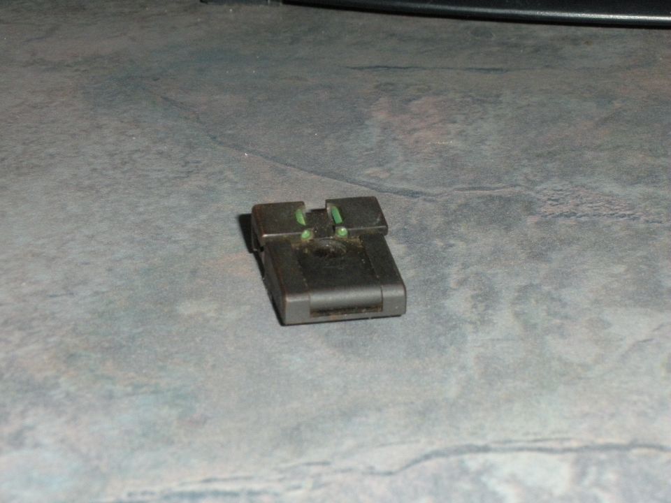 Black gun sight with green front and rear sights