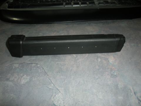 1996 Ford Bronco - This is a black plastic car part, possibly a trim piece or bumper component.