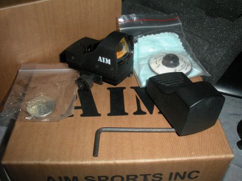 1996 Ford Bronco - AIM red dot sight and accessories are laid out on a cardboard box.