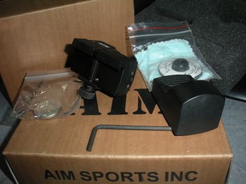 1996 Ford Bronco - AIM Sports scope mount and accessories are laid out on a cardboard box with other items.