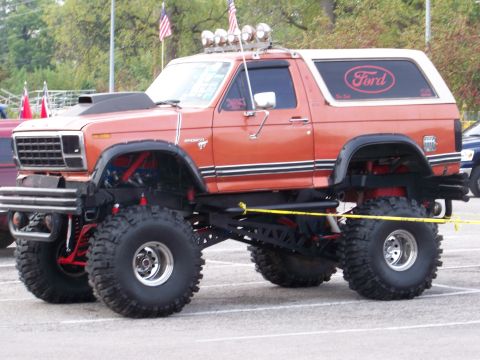 1989 Ford Bronco - This heavily modified Ford Bronco features an extreme lift kit and oversized off-road tires.