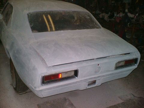 1989 Ford Bronco - This car's rear end shows rectangular taillights and a trunk lid, but no year-identifying badges are visible.