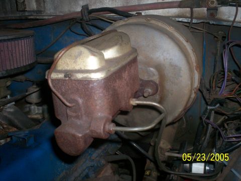1978 Ford Bronco - Close-up view of the brake booster and master cylinder assembly, showing engine components and wiring.