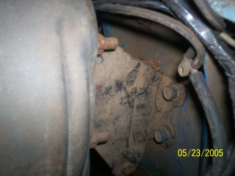 1978 Ford Bronco - A close-up view of a dusty engine bracket with bolts and wiring, showing a date stamp of 05/23/2005.
