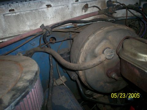 1978 Ford Bronco - Close-up view of the engine bay, showing the brake booster and an aftermarket air filter assembly.