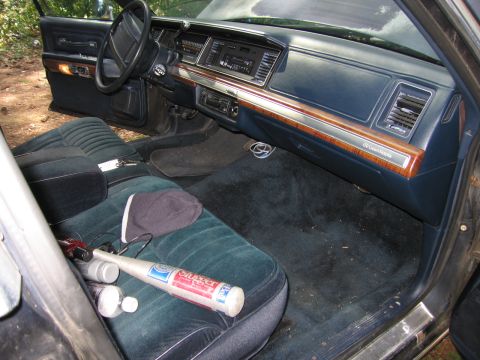 1991 Ford LTD Crown Victoria - Interior view of a 1991 Ford Crown Victoria LTD, with a baseball bat on the seat.