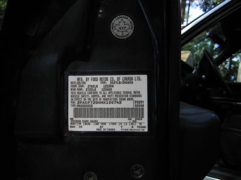 1991 Ford LTD Crown Victoria - Ford Motor Co. of Canada certification data plate showing GVWR ratings, VIN 2FACP72G4NX100742 and paint/trim codes.