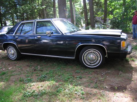 1991 Ford LTD Crown Victoria - This sedan has a boxy body style typical of cars from the early 1980s.