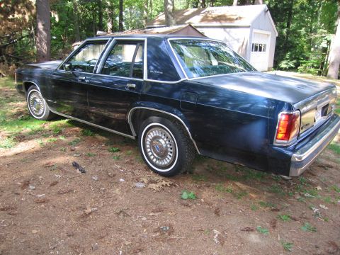1991 Ford LTD Crown Victoria - This 1991 Ford Crown Victoria LTD is shown from the rear three-quarter angle, parked outdoors.