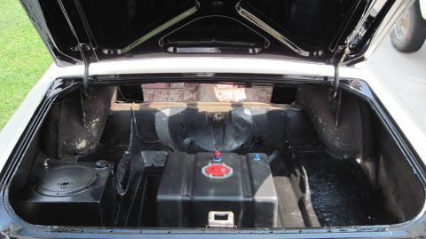 1992 Ford Mustang - The trunk of a 1964 Fairlane shows a fuel cell and a speaker system installed.