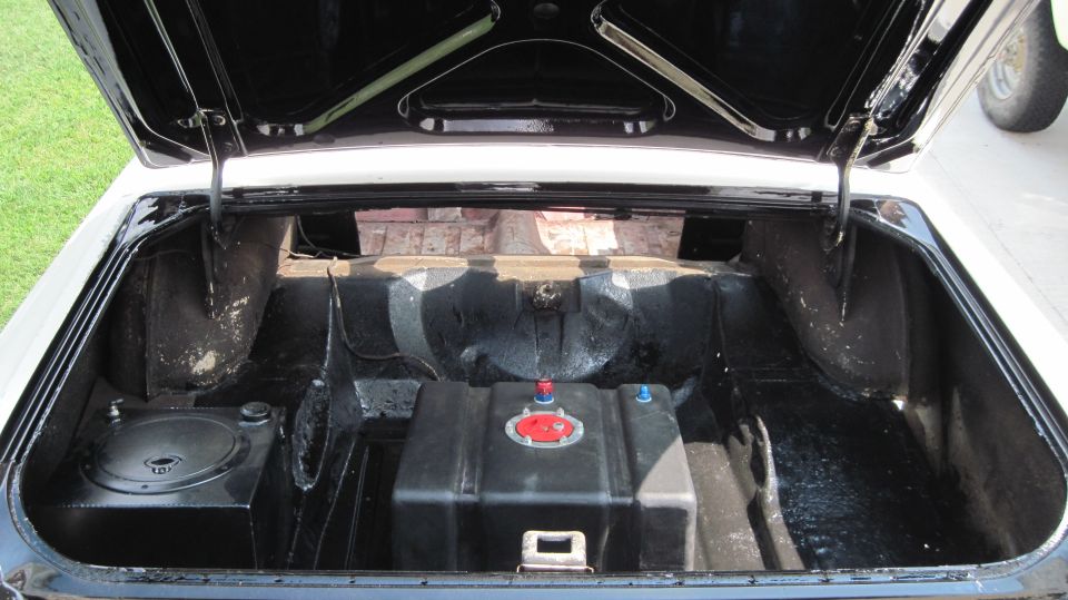 Trunk interior with fuel cell and speaker. 1964 Fairlane