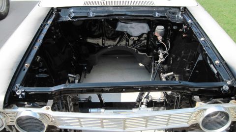 1992 Ford Mustang - The engine bay of a classic car is shown after engine removal, ready for restoration or modification.