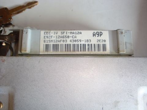 1989 Ford Bronco - Ford EEC-IV engine control unit with part numbers and keys visible.