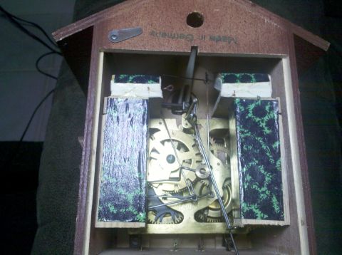 1978 Ford Bronco - The internal workings of a cuckoo clock reveal intricate gears and a pendulum mechanism.