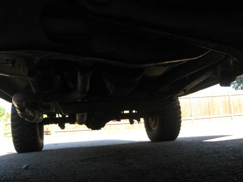 1981 Ford Bronco - Undercarriage view of a 4x4 vehicle, focusing on suspension and exhaust components.