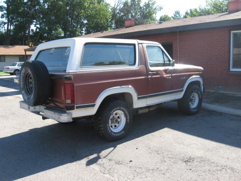 1981 Ford Bronco - This Ford Bronco has a two-tone paint scheme and a spare tire on the back.