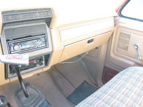 1981 Ford Bronco - The interior of a 1981 Ford Bronco features an aftermarket stereo and a B&M shifter.