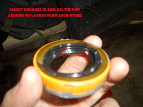 2002 Ford Crown Victoria - A seal is held by a hand, showing slight grooves around its circumference.