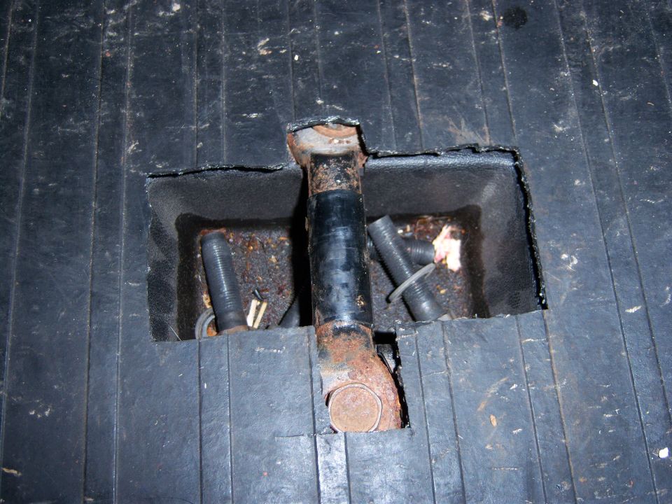 Child seat tether anchor in black floor mat