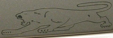2000 Mercury Grand Marquis - Jaguar emblem detail, possibly from a vehicle part.