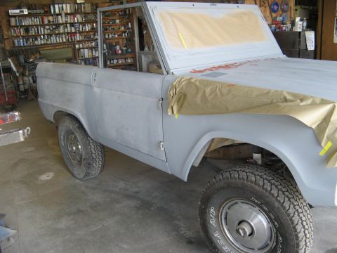 1966 Ford Bronco - This 1966 Ford Bronco is undergoing restoration, with its front fender taped off for preparation.