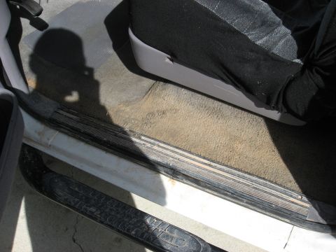 1994 Ford Bronco - Interior view of a 1994 Ford Bronco, focusing on the door sill and carpet.