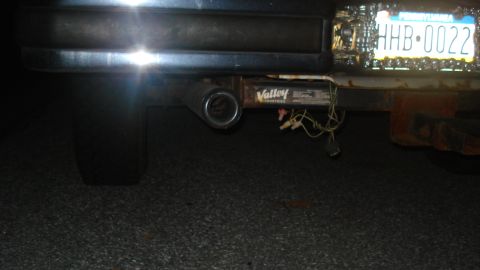 1988 Ford Bronco - The rear of a vehicle is shown, focusing on the trailer hitch and license plate.