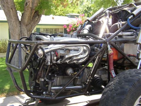 1993 Ford Taurus - The engine and exposed roll cage of a custom off-road vehicle are visible, with a Supermotors.net logo in the corner.