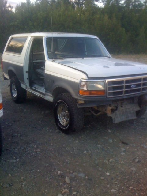 1993 Ford Bronco - This 1993 Ford Bronco is seen with its doors open and missing its front bumper.