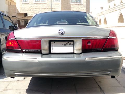 2001 Mercury Grand Marquis - This 2001 Mercury Grand Marquis features a rear view with its distinctive taillights and a Kuwaiti license plate.