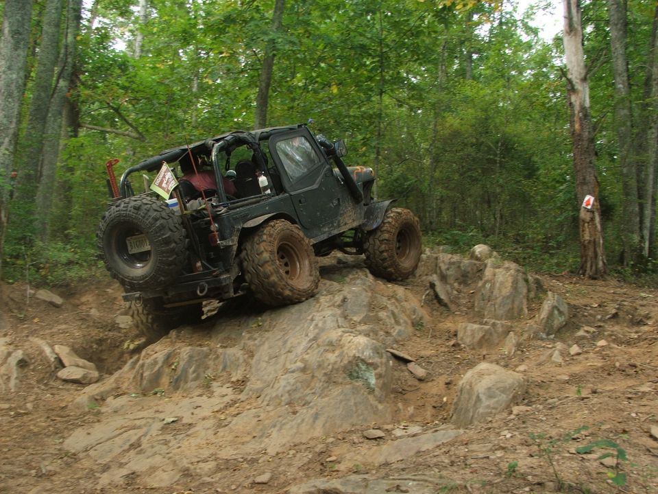 Off-road vehicle climbing rocky terrain
