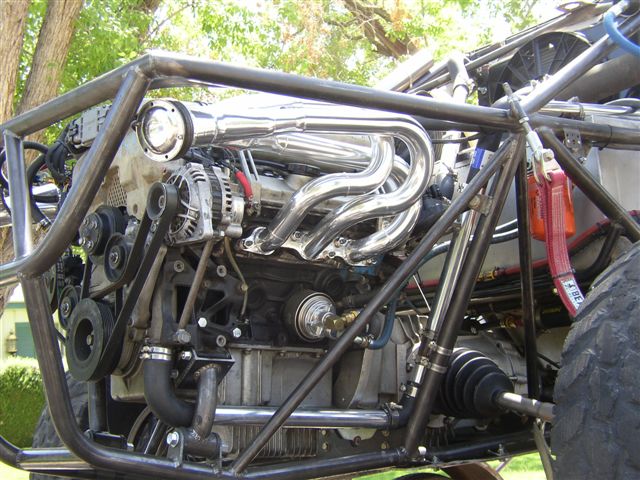 Engine with chrome headers and roll cage
