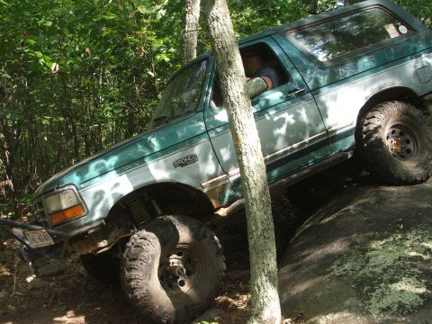 1996 Ford Bronco - This 1996 Ford Bronco is shown tackling a challenging off-road obstacle.