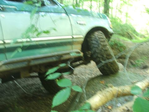 1996 Ford Bronco - This 1996 Ford Bronco is navigating a challenging off-road trail.