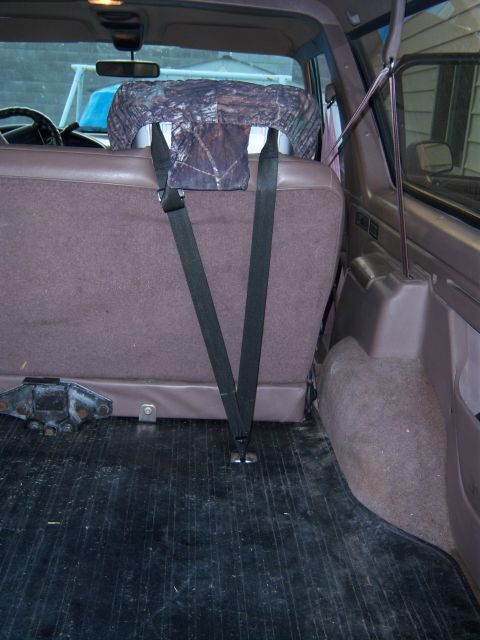 1996 Ford Bronco - The interior of a 1996 Ford Bronco, focusing on the rear seating and cargo space.