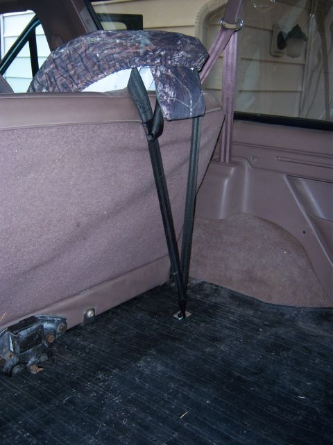 1996 Ford Bronco - Rear interior view of a 1996 Ford Bronco, highlighting the child seat tether system and a camouflage seat cover.
