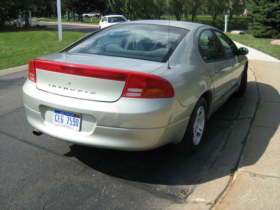 Silver Dodge Intrepid parked on a driveway. Michigan license plate CEG 7590