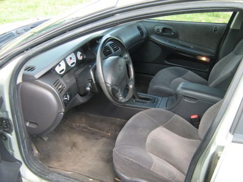 1988 Mercury Grand Marquis - Interior of a 1998 Dodge Intrepid, showing the driver's side dashboard and front seats.