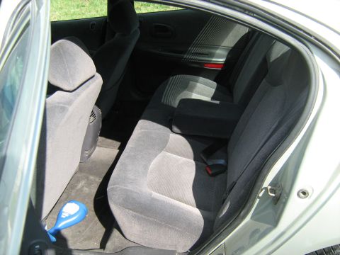 1988 Mercury Grand Marquis - The interior of a car shows the rear seats and door panel. The registry claims it is a 1988 Mercury Grand Marquis, but this is unlikely.