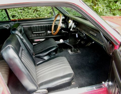 1967 Mercury Cougar - Interior view of a 1967 Mercury Cougar, showing the dashboard, seats, and floor shifter.