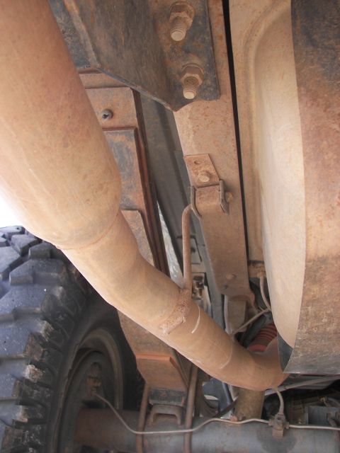 1995 Ford Bronco - Undercarriage view of a 1995 Ford Bronco, highlighting the exhaust system and rear suspension components.