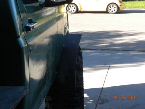 1989 Ford Bronco - This vehicle has been modified with large off-road tires and custom fender flares.
