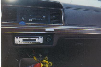 1990 Mercury Grand Marquis - Interior shot of a 1990 Mercury Grand Marquis, showing the dashboard and an aftermarket stereo.